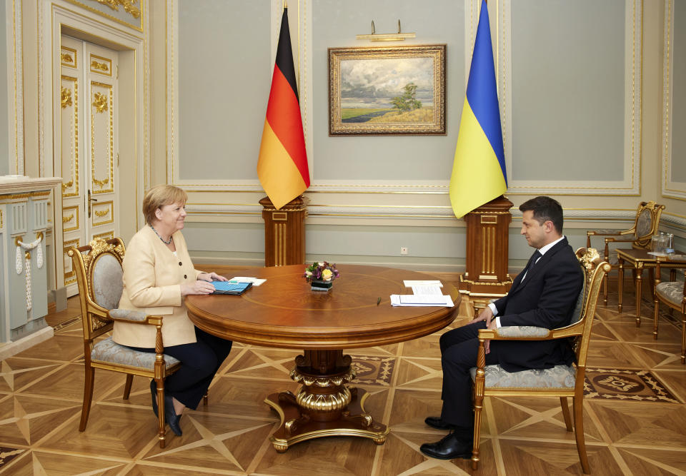 Ukrainian President Volodymyr Zelenskyy, right, and German Chancellor Angela Merkel during their meeting in Kyiv, Ukraine, Sunday, Aug. 22, 2021. (Ukrainian Presidential Press Office via AP)