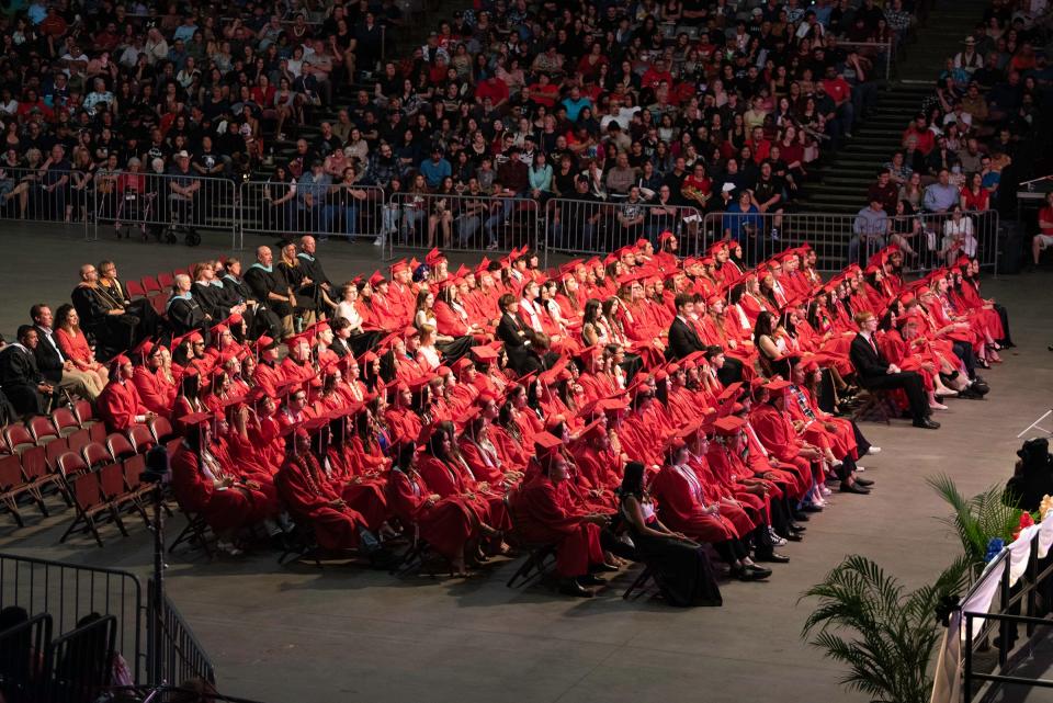 Pueblo Centennial High School graduates listen to speakers during the school's commencement ceremony on Friday, May 26, 2023.