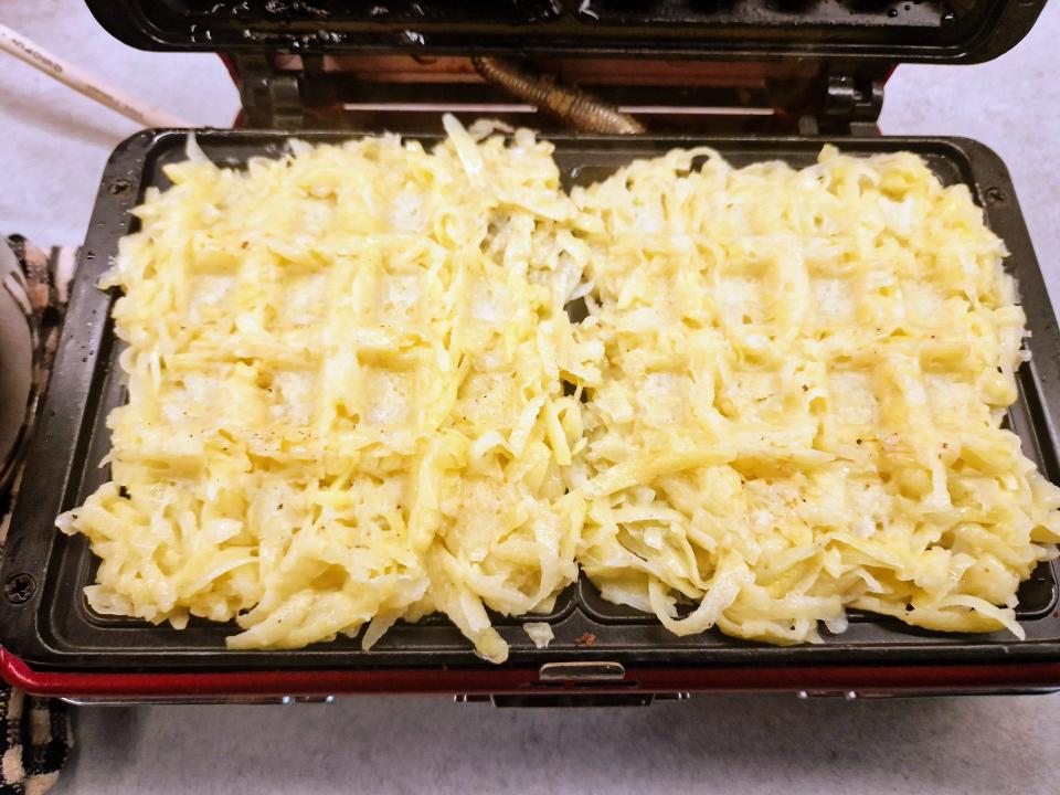 hash browns packed in a square waffle iron