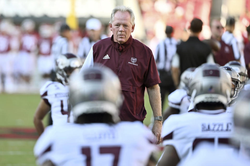 FILE - Missouri State coach Bobby Petrino watches his team warm up before playing Arkansas before an NCAA college football game, Sept. 17, 2022, in Fayetteville, Ark. Texas A&M head coach Jimbo Fisher hired Bobby Petrino in a bid to rejuvenate the offense _ and his fortunes with the Aggies. (AP Photo/Michael Woods, File)