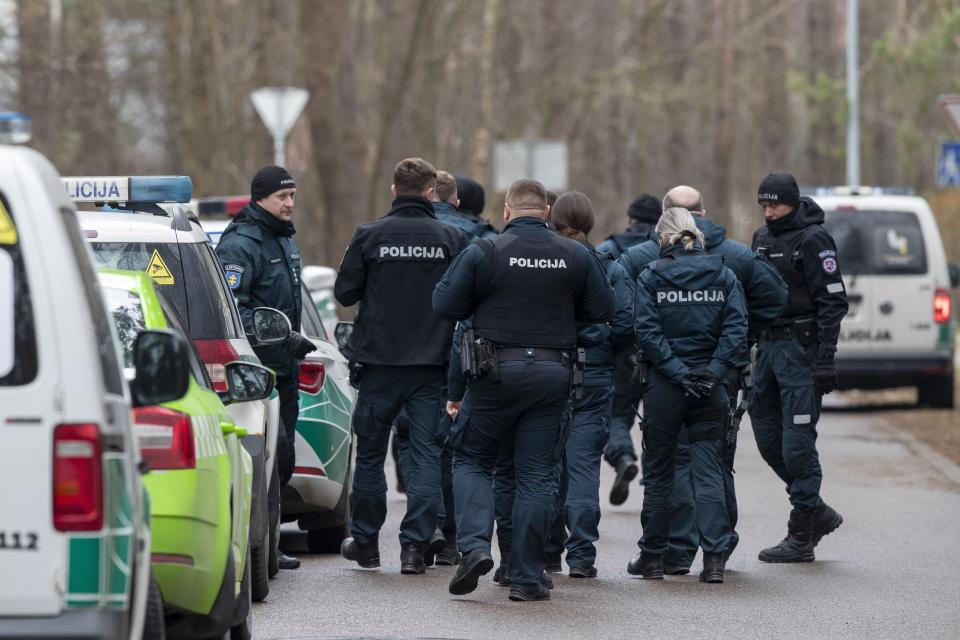 Police officers patrol the area near the house of Leonid Volkov, a close associate of the late Russian opposition leader Alexei Navalny, in Vilnius, Lithuania, Wednesday, March 13, 2024. Volkov on Wednesday blamed the government of Russian President Vladimir Putin after he was attacked with a hammer and tear gas outside his home near the Lithuanian capital, where he lives in exile, the late Navalny's anti-corruption foundation said.(AP Photo/Mindaugas Kulbis)