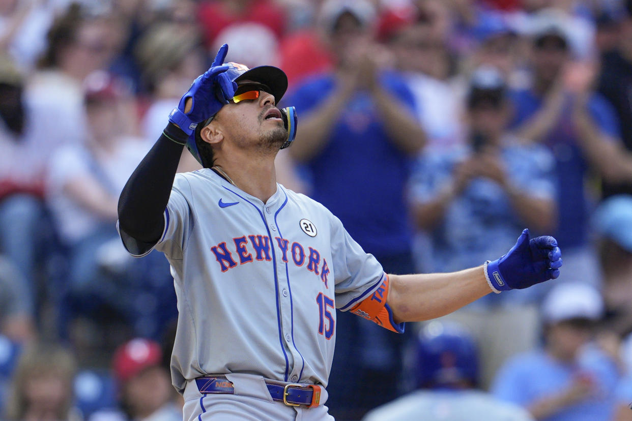 New York Mets' Tyrone Taylor reacts after hitting a solo home run off Philadelphia Phillies' Cristopher Sánchez during the eighth inning of a baseball game, Sunday, Sept. 15, 2024, in Philadelphia. (AP Photo/Derik Hamilton)