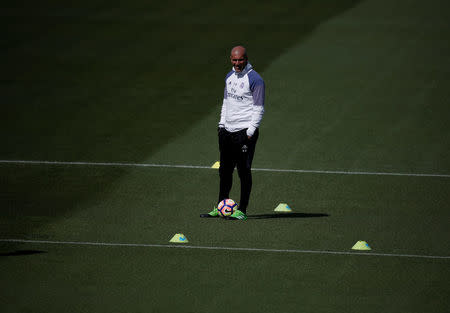 Football Soccer- Real Madrid training - Valdebebas training grounds, Madrid, Spain - 22/04/17 Real Madrid's coach Zinedine Zidane attends training session. REUTERS/Sergio Perez