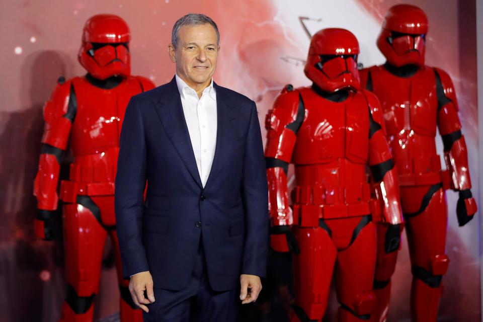 Disney CEO Bob Iger poses on the red carpet with sith stormtroopers upon arrival for the European film premiere of Star Wars: The Rise of Skywalker in London on December 18, 2019. (Photo by Tolga AKMEN / AFP) (Photo by TOLGA AKMEN/AFP via Getty Images)