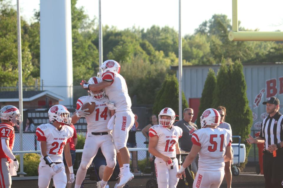 Port Clinton's Dagan Meyers celebrates a score with Cam Gillum.