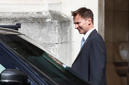 PM hopeful Jeremy Hunt walks near the Parliament grounds in London