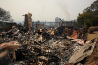 <p>The remains of the fire damaged Signarello Estate Winery after an out of control wildfire moved through the area on Oct. 9, 2017 in Napa, Calif. (Photo: Justin Sullivan/Getty Images) </p>