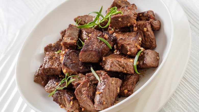 steak bites in white bowl