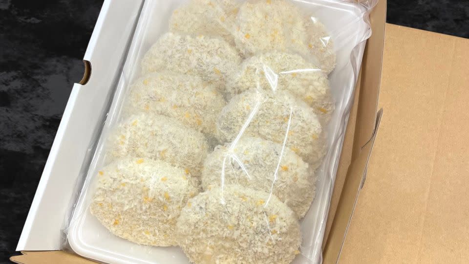 The beef croquettes arrive in this sealed packaging. - Asahiya