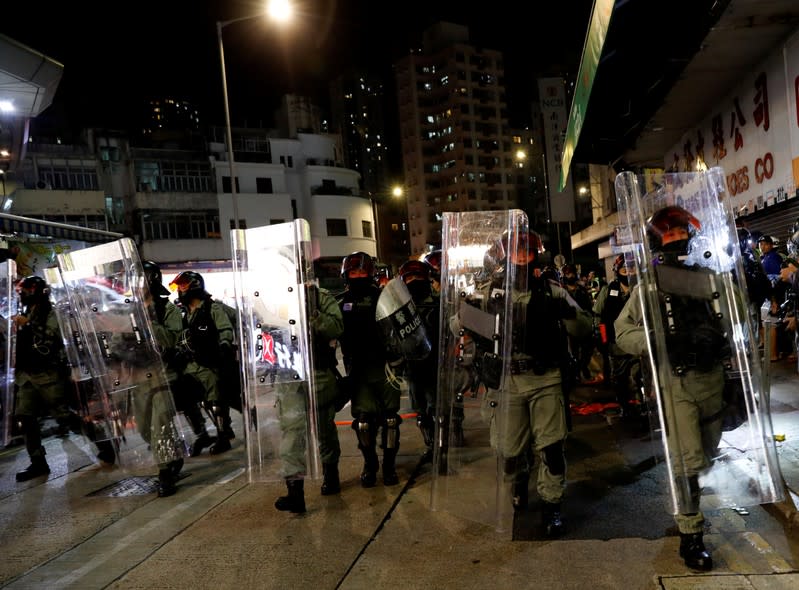 Riot police disperse pro-democracy demonstrators gathering to commemorate the three-month anniversary of an assault by more than 100 men on protesters, commuters and journalists, in Hong Kong
