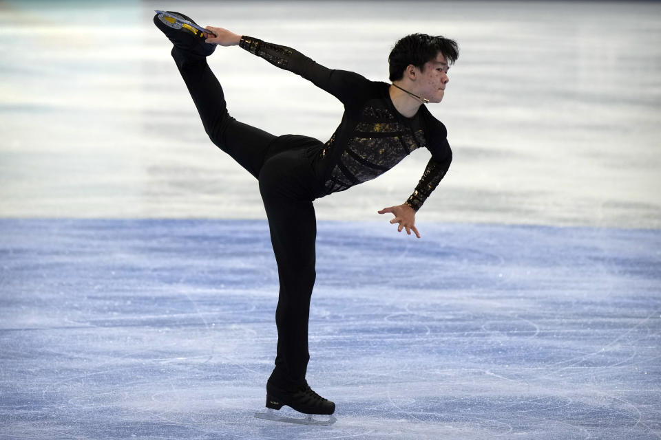 Yuma Kagiyama of Japan performs in the men's free skating competition at the Asian Open Figure Skating Trophy, a test event for the 2022 Winter Olympics, at the Capital Indoor Stadium in Beijing, Friday, Oct. 15, 2021. (AP Photo/Mark Schiefelbein)