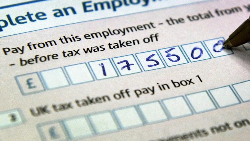 A tax form (Tim Ireland/PA) (PA Archive)