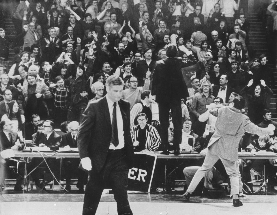 Marquette coach Al McGuire celebrates a victory over Wisconsin in 1974.