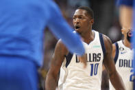 Dallas Mavericks forward Dorian Finney-Smith reacts after hitting a basket during the second half of the team's NBA basketball game against the Denver Nuggets on Tuesday, Dec. 6, 2022, in Denver. (AP Photo/David Zalubowski)
