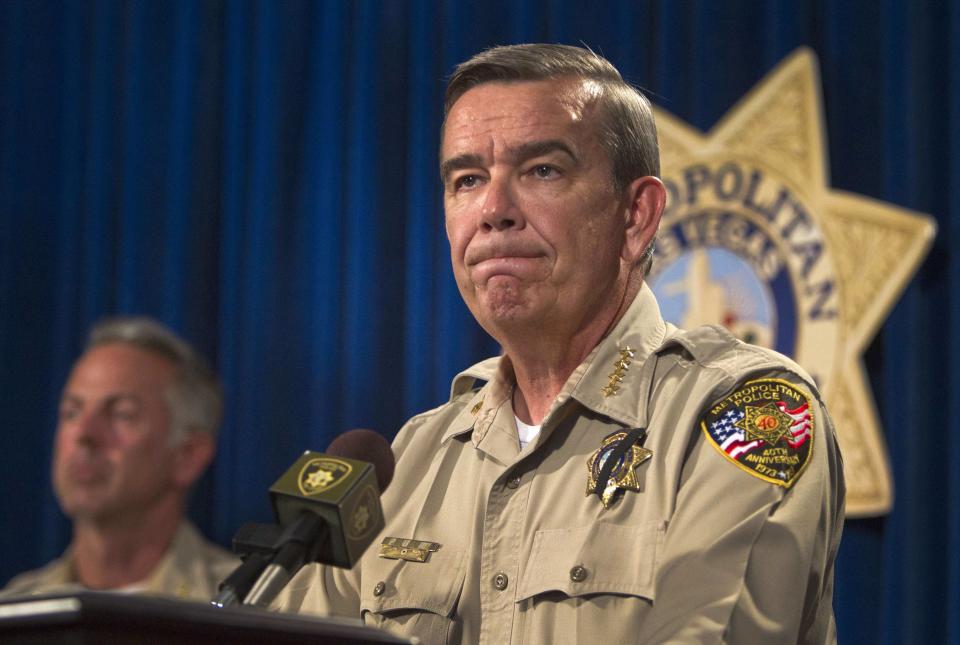Clark County Sheriff Doug Gillespie takes questions during a news conference at Metro headquarters following the death of two officers and a citizen in Las Vegas June 8, 2014. Two suspects, also dead, shot two Metro Police officers in a pizza shop then fled to a nearby Wal-Mart where they shot and killed another person, police said. REUTERS/Las Vegas Sun/Steve Marcus (UNITED STATES - Tags: CIVIL UNREST CRIME LAW)