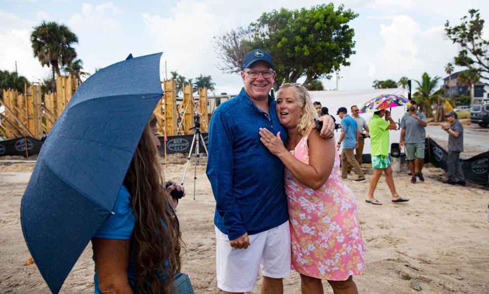 Debi Szekely gets a hug from neighbor, Scott Safford during a groundbreaking for her new home on Hibiscus Drive on Fort Myers Beach on Friday, Sept. 8, 2023. Her home was destroyed in Hurricane Ian last year. Homebound is building a new home on the property.