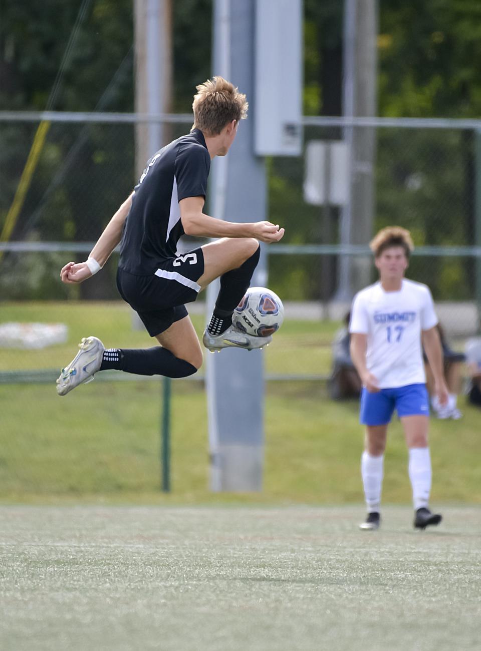 Charlie Isphording of Indian Hill, kicking the ball against Summit Country Day, has been voted one of the top boys soccer players in Ohio in 2023.