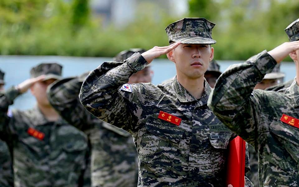 Tottenham Hotspur forward Son Heung-min salutes during a basic military training completion ceremony - South Korea Marine Corps' Facebook 