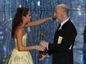 Sweden's Alicia Vikander receives from J.K. Simmons (R) the Oscar for Best Supporting Actress for her role in "The Danish Girl" at the 88th Academy Awards in Hollywood, California February 28, 2016. REUTERS/Mario Anzuoni