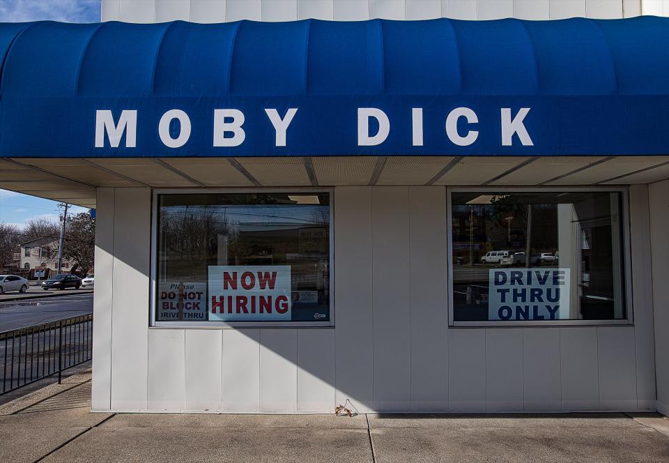 A Now Hiring sign is displayed in the window of the Moby Dick restaurant at Dixie Hwy. and Johnsontown Rd. in Southwest Jefferson Co. Many businesses are strugging to stay open and retain employees during the current labor shortage. January 12, 2022