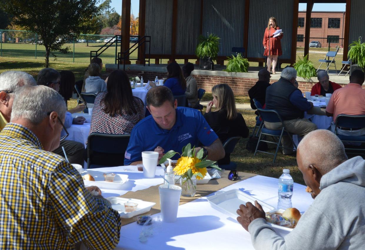 Chamber Director Amy Howard addresses business leaders gathered at the organization's annual meeting.