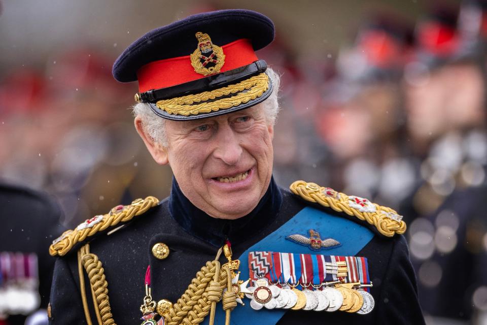 Britain's King Charles III inspects graduating officer cadets march during the 200th Sovereign's Parade at the Royal Military Academy, Sandhurst, southwest of London on April 14, 2023.