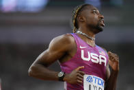 Noah Lyles, of the United States slows down after winning a men's 100-meters heat during the World Athletics Championships in Budapest, Hungary, Saturday, Aug. 19, 2023. (AP Photo/Petr David Josek)
