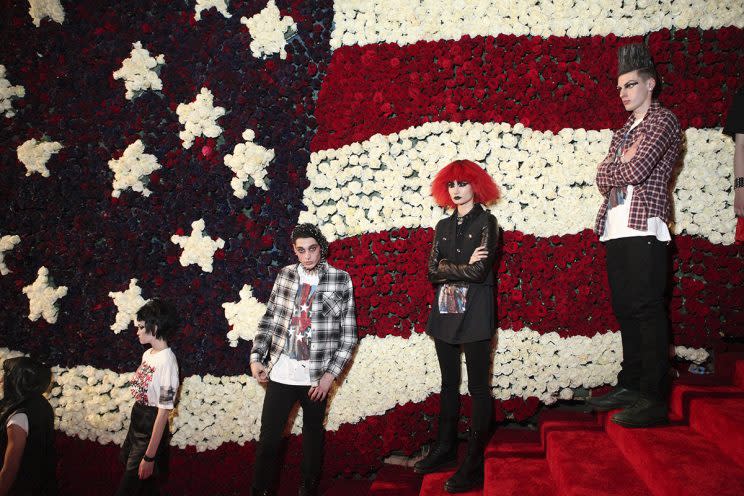 Models dressed as punks line the entrance stairs decorated with an American flag made of roses at the Metropolitan Museum of Art's Costume Institute Gala, in New York, May 6, 2013. The annual gala celebrated 
