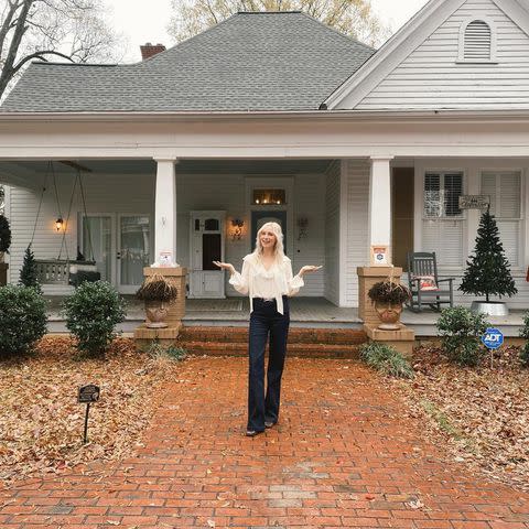 <p>Candice King/Instagram</p> Candice King standing in front of Caroline Forbes' house in 'The Vampire Diaries'