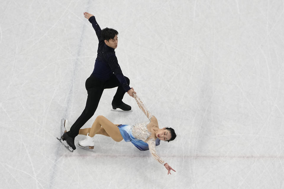Sui Wenjing and Han Cong, of China, compete in the pairs free skate program during the figure skating competition at the 2022 Winter Olympics, Saturday, Feb. 19, 2022, in Beijing. (AP Photo/Jeff Roberson)