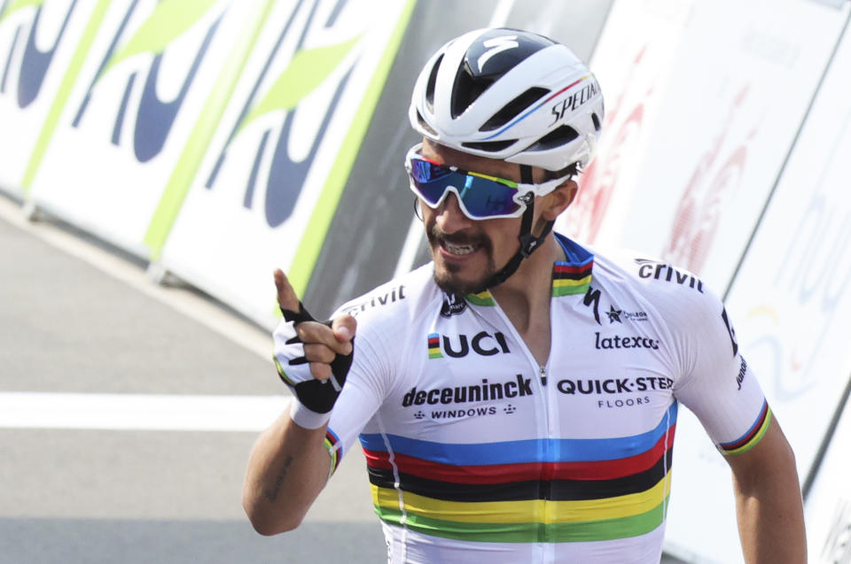 France's Julian Alaphilippe of the Deceuninck Quick-Step team crosses the finish line to win the Belgian cycling classic and UCI World Tour race Fleche Wallonne, in Huy, Belgium, Wednesday, April 21, 2021. (AP Photo/Olivier Matthys)