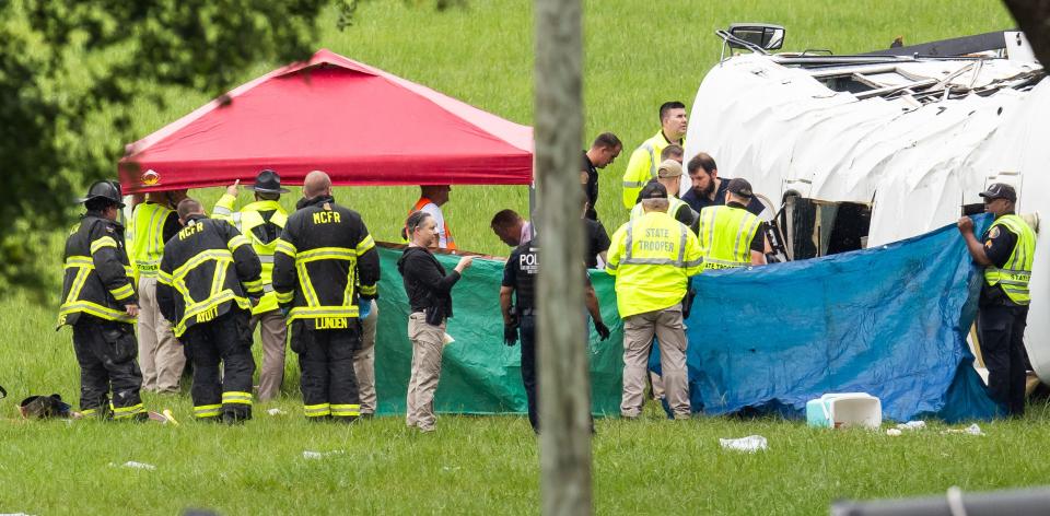 Emergency workers at the scene of Tuesday's deadly crash that killed eight migrant workers.