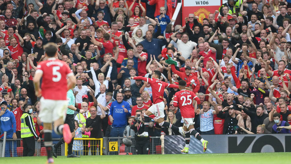 Seen here, fans erupt inside Old Trafford after Cristiano Ronaldo scores a goal on his return.