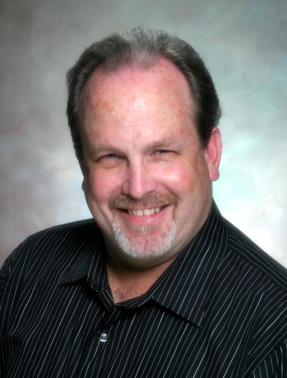 Jeffrey Clayton was the longtime choral music teacher at Douglas Anderson School of the Arts. This is a file photo from 2008, shortly after he and his department received the designation of Signature Grammy Gold School through the Grammy Awards Foundation.