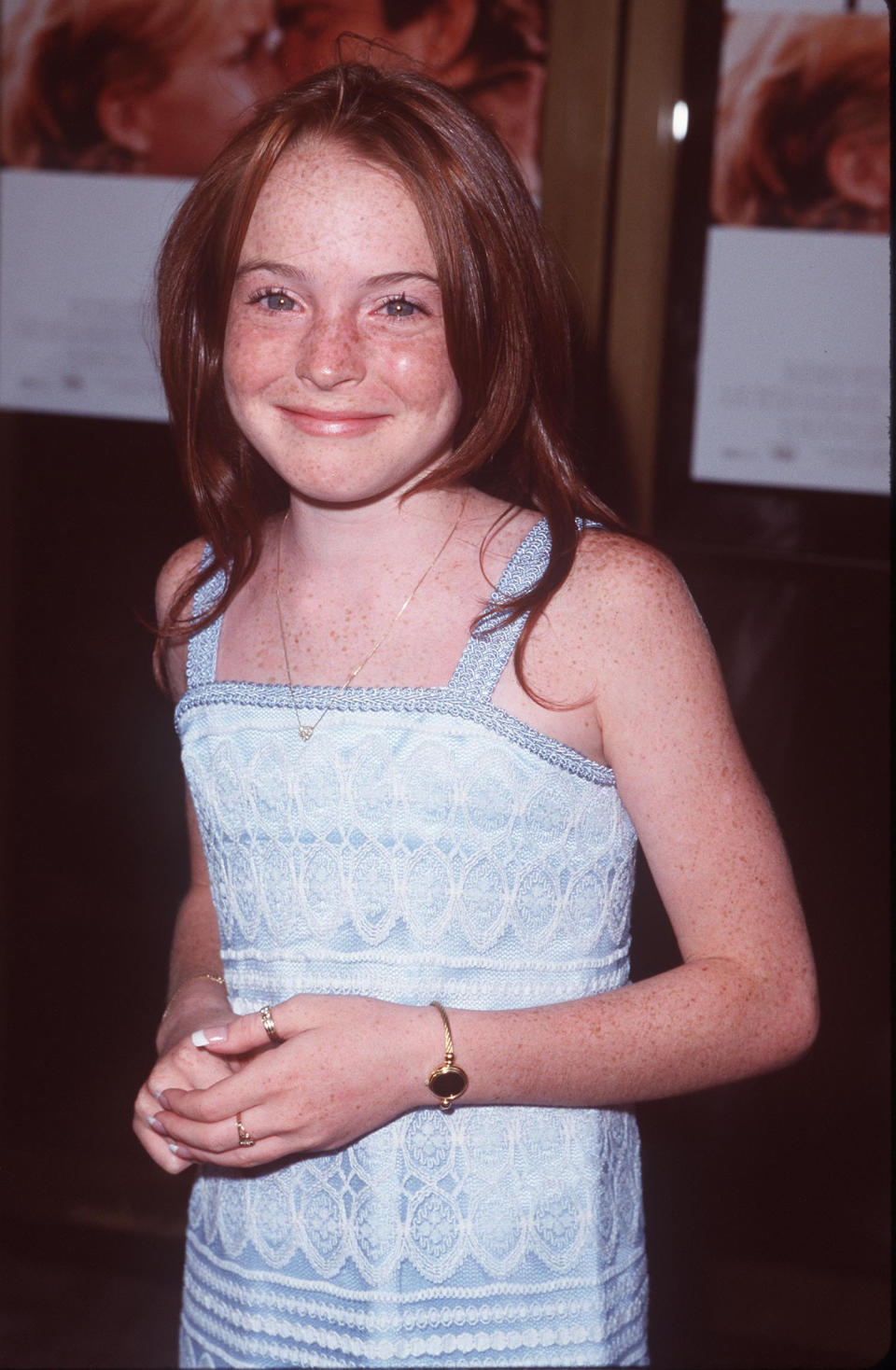 Smiling Lindsay in a sleeveless threaded dress