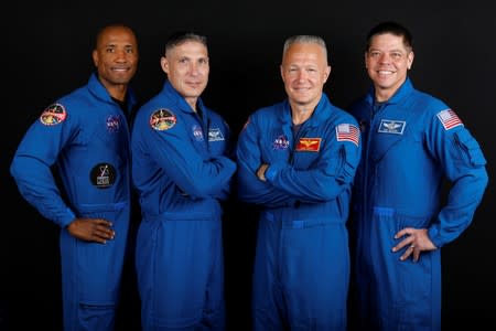 NASA commercial crew astronauts Victor Glover, Michael Hopkins, Douglas Hurley and Bob Behnken pose for a portrait at Johnson Space Center in Houston, Texas