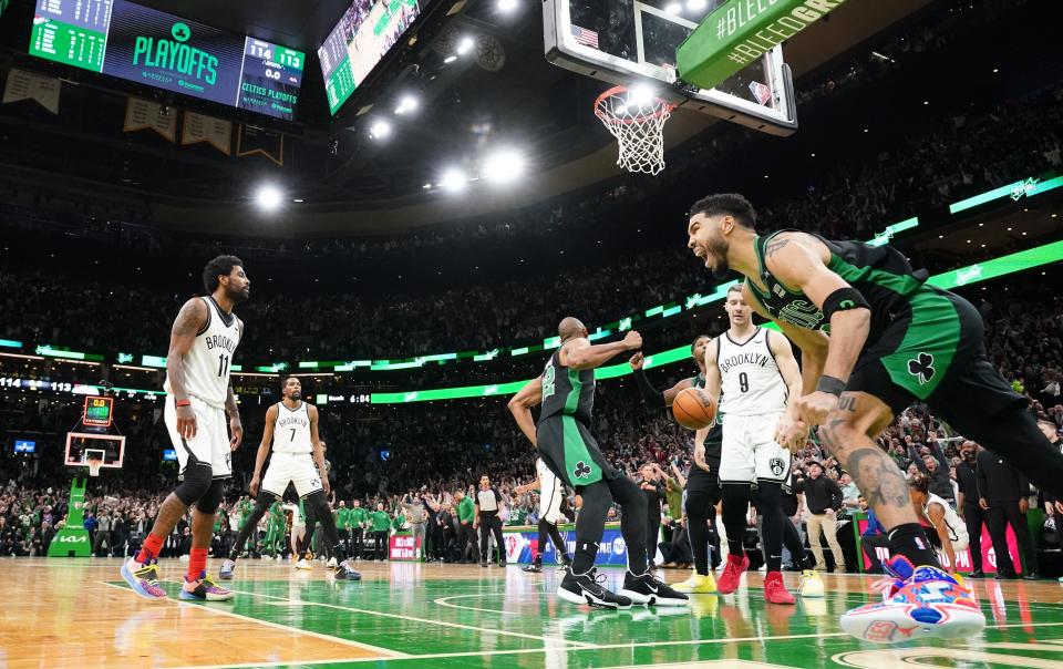 Boston Celtics forward Jayson Tatum celebrates after hitting the winning layup as time expired in Game 1 of a playoff series with Brooklyn.