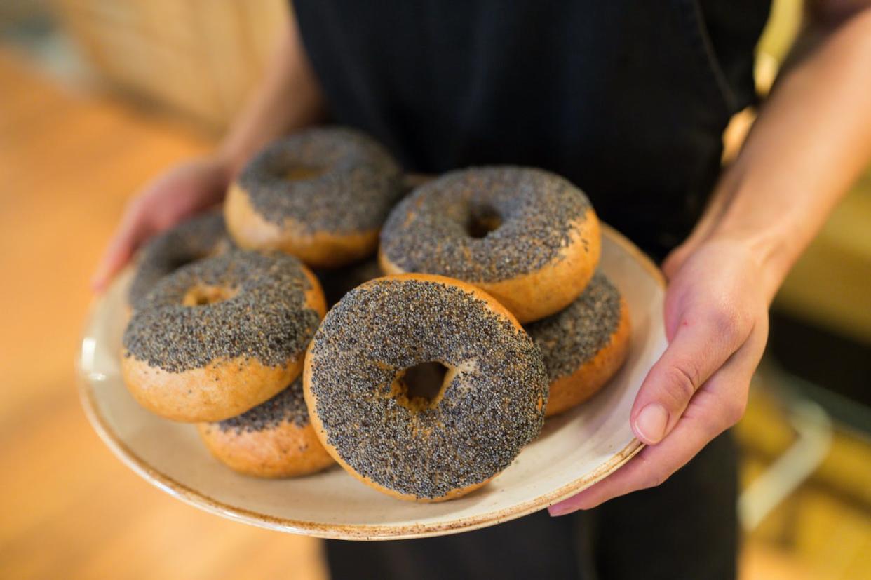 Eating culinary poppy seeds won’t get you high, but they could lead to a failed drug test. <a href="https://www.gettyimages.com/detail/photo/midsection-of-woman-holding-bagels-in-plate-royalty-free-image/691138209" rel="nofollow noopener" target="_blank" data-ylk="slk:Linda Caldwell/EyeEm via Getty Images;elm:context_link;itc:0;sec:content-canvas" class="link ">Linda Caldwell/EyeEm via Getty Images</a>