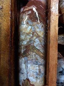 Hydrothermal silica breccia with iron oxides and pyrite box works, drill hole NP-21-04, drill core diameter 6.4 cm.