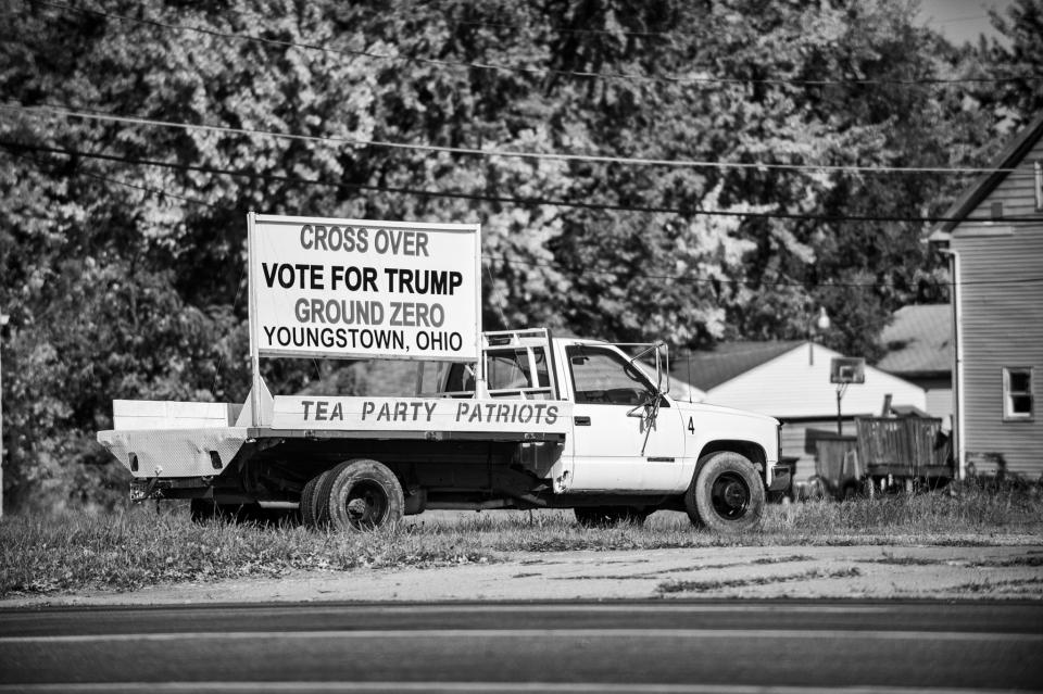 A tea party sign supporting Donald Trump sits on the back of a truck