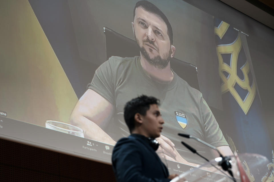 Ukrainian President Volodymyr Zelensky gives a virtual adress to students of the Institute of Political Studies (IEP) or Sciences Po university, in Paris, Wednesday, May 11, 2022. (AP Photo/Thibault Camus)