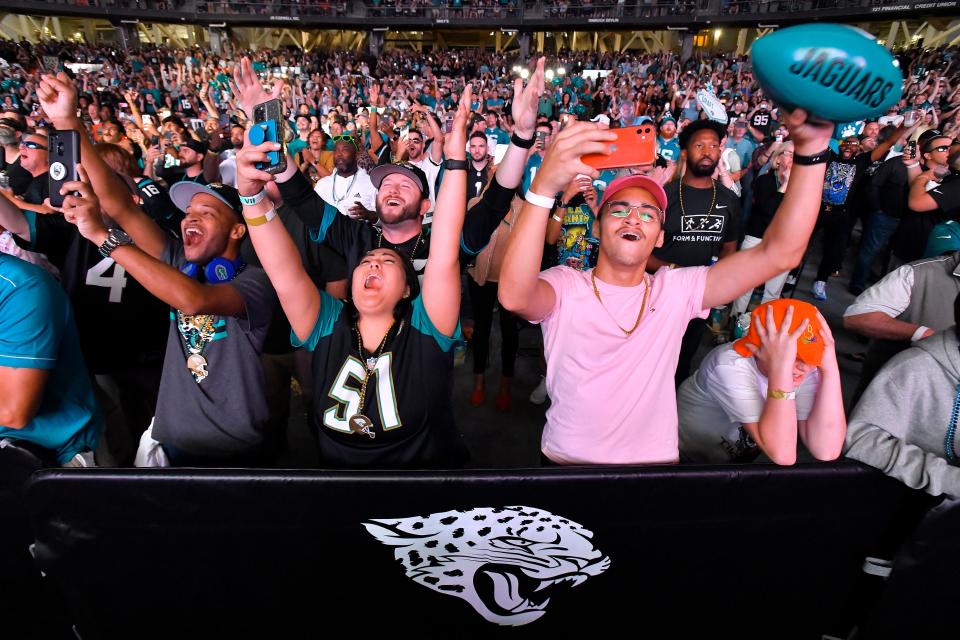 Jacksonville Jaguars fans celebrate as Georgia's Travon Walker is announced as the team's first pick No. 1 overall in the NFL football draft, during a draft party Thursday, April 28, 2022, in Jacksonville, Fla.