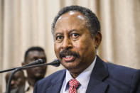 FILE - In this Wednesday, Aug. 21, 2019 file photo, Sudan's Prime Minister Abdalla Hamdok speaks during a news conference in Khartoum, Sudan.Sudan's information ministry says the country's interim prime minister Hamdok and a number of senior government officials have been arrested. The ministry described ctions as a military coup, Monday, Oct 25, 2021. (AP Photo, File)