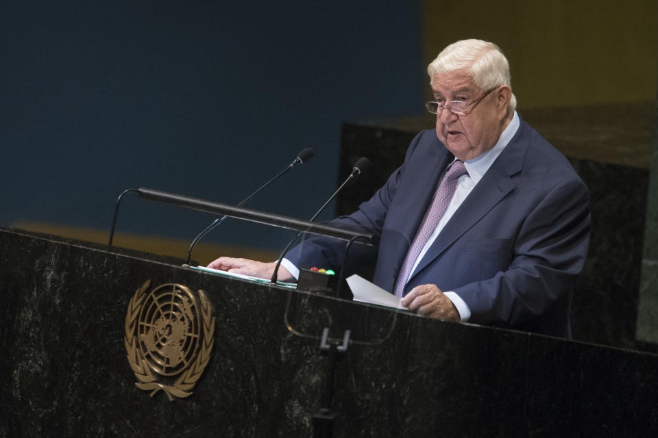 CORRECTS NAME OF SYRIAN DEPUTY PRIME MINISTER TO WALID AL-MOALLEM - Syrian Deputy Prime Minister Walid al-Moallem addresses the 73rd session of the United Nations General Assembly, Saturday, Sept. 29, 2018 at U.N. headquarters. (AP Photo/Mary Altaffer)