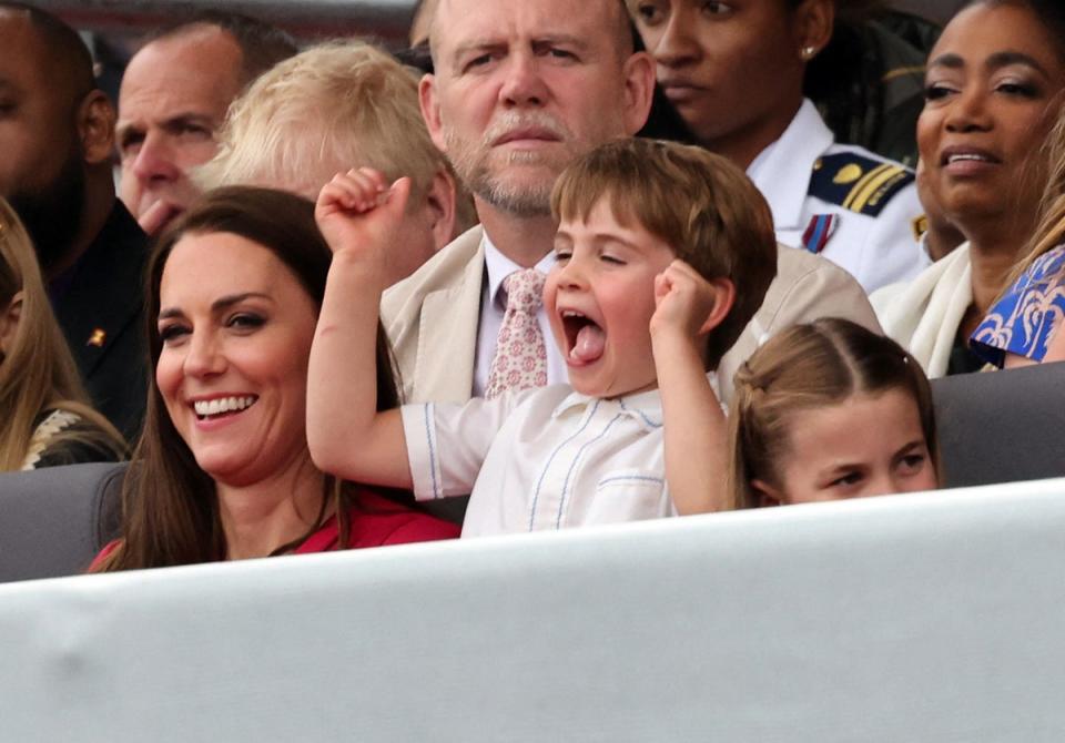 Louis cheers on performers (POOL/AFP via Getty Images)