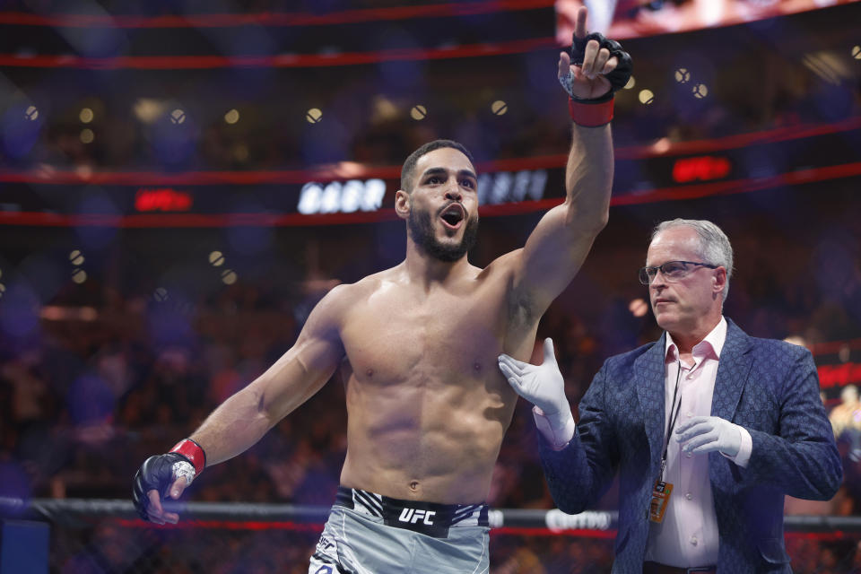 Jul 29, 2023; Salt Lake City, Utah, USA; Gabriel Bonfim (red gloves) reacts to defeating Trevin Giles (blue gloves) during UFC 291 at Delta Center. Mandatory Credit: Jeff Swinger-USA TODAY Sports