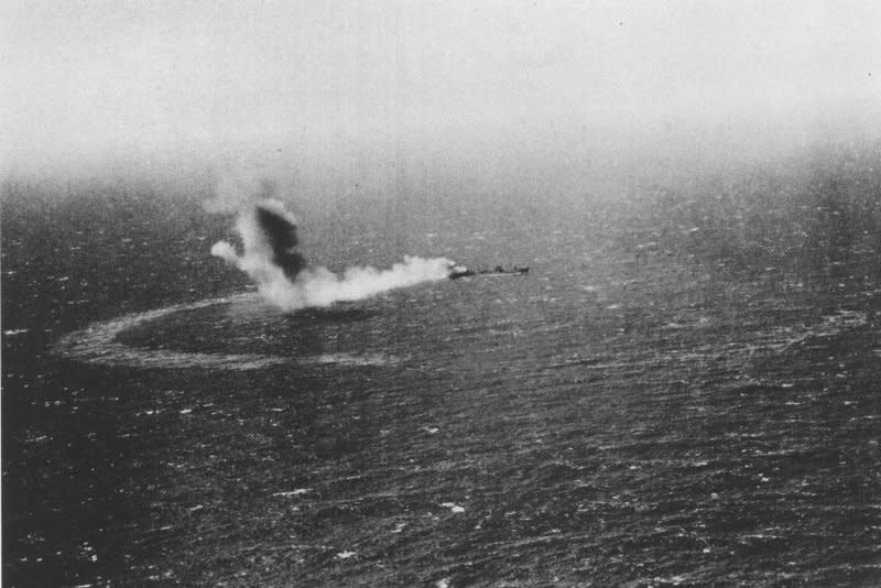 The U.S. Navy fleet oiler USS Neosho burns and slowly sinks after an attack by Imperial Japanese Navy dive bombers on May 7, 1942, during the Battle of the Coral Sea. File Photo courtesy of Wikimedia