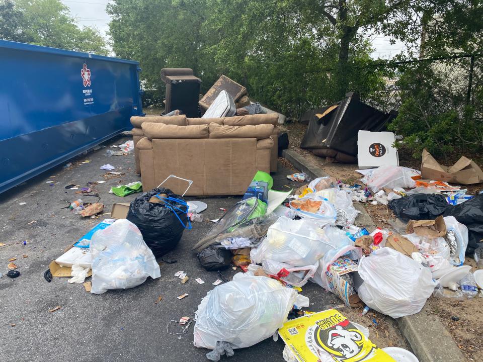 Residents at the Pines at Warrington apartment complex are frustrated with the trash and debris building up around their apartments and inside the building.