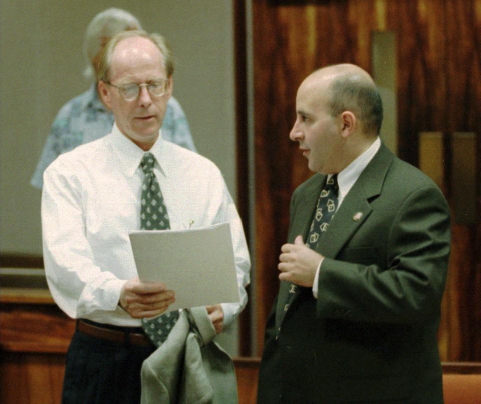 State Deputy Attorney General Rick Eichor, left, looks over papers from plaintiff attorney Evan Wolfson before the start of a same-sex marriage trial in Honolulu in 1996.