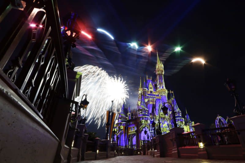 Guests watch the "Happily Ever After" fireworks show at Disney World in Florida. On Wednesday, Walt Disney Company announced ticket and parking price hikes at its Florida and California parks as it prepares for a $60 billion expansion. File Photo by John Angelillo/UPI